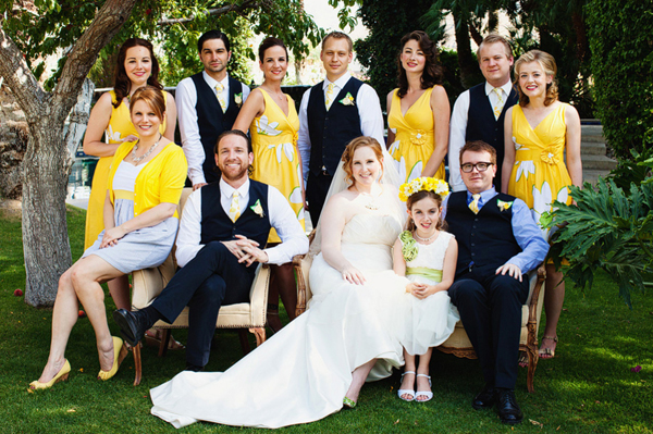 bridal party sitting under the tree