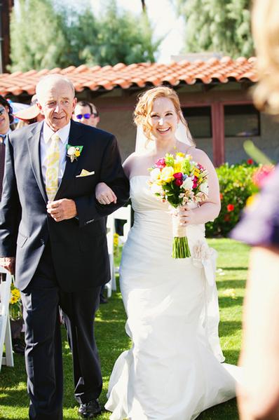father and bride walking down the aisle