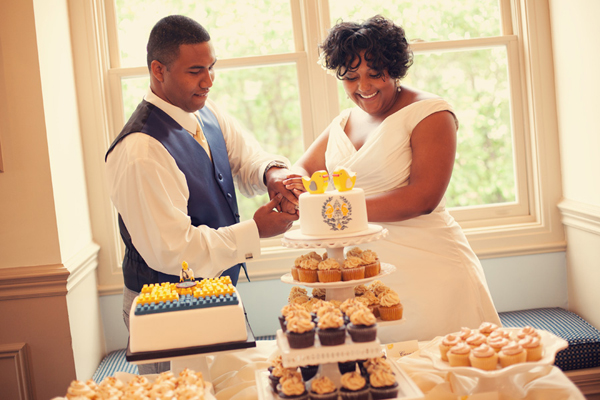 bride and groom cutting the cake