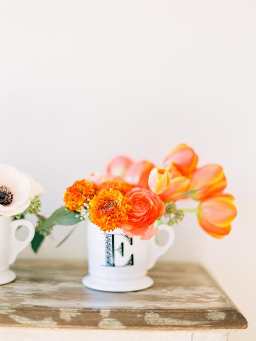 Orange tulips and ranunculus centerpiece