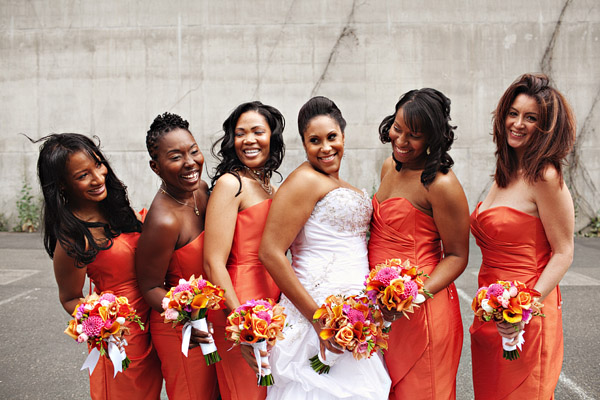 bridesmaids wearing orange dresses