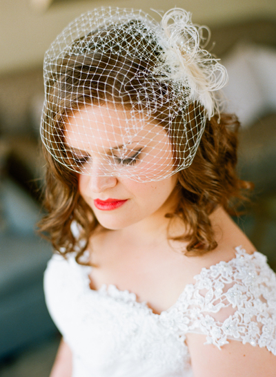 bride wearing birdcage veil