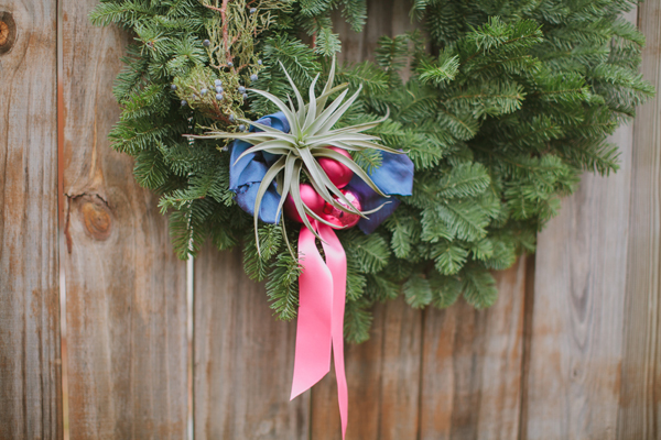 Holiday wreath with pink and blue ribbon
