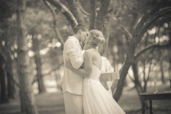 groom kissing bride