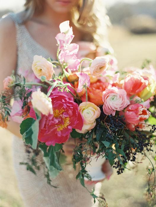 bride holding centerpiece