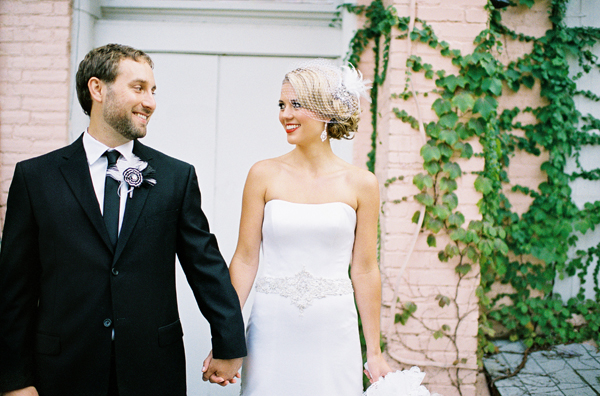 bride and groom holding hands