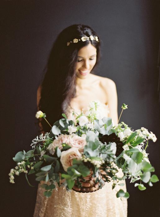 Bride holding centerpiece