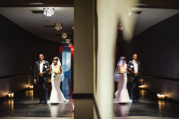 father and bride walking down the aisle