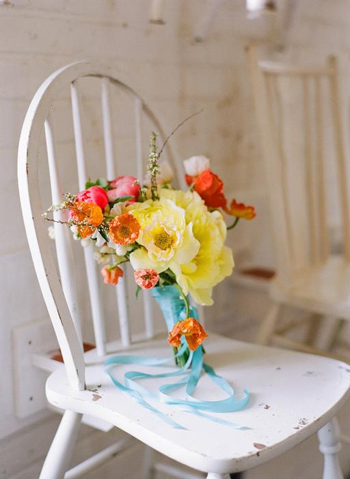 orange poppies, yellow peony, snow berries, blue ribbon