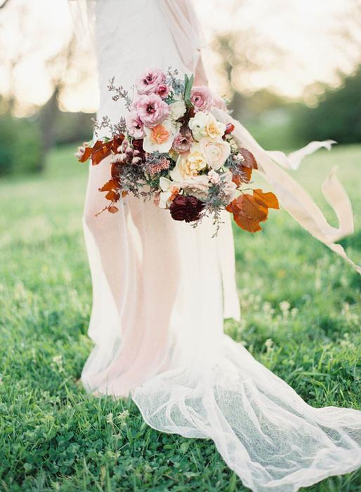 bridal bouquet with ranunculus, garden roses and foliage