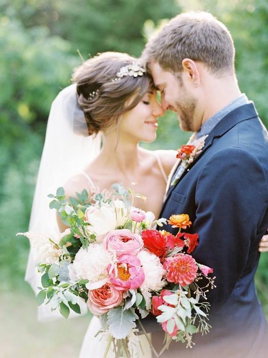 bride holding peony bouquet