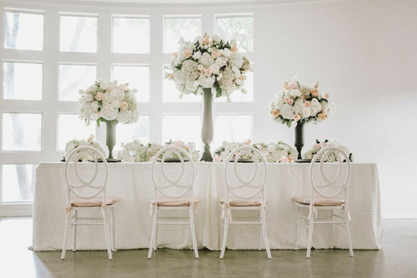 white hydrangea centerpiece on reception table