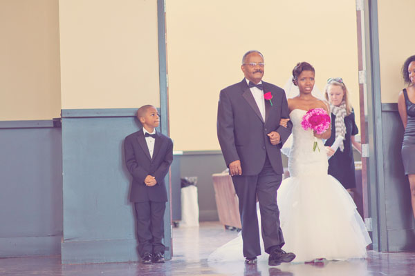 father and daughter walking down the aisle
