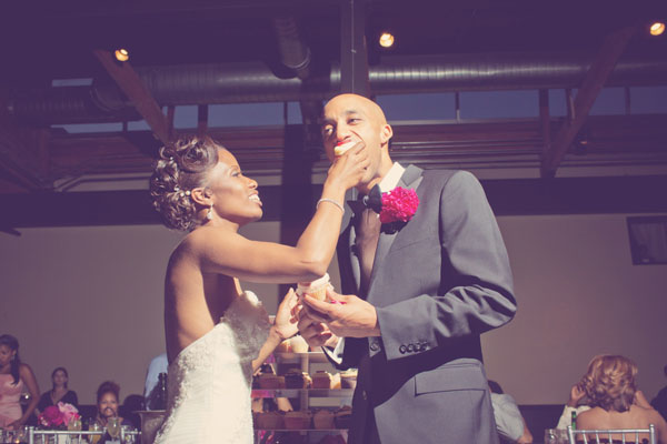 bride and groom eating cake